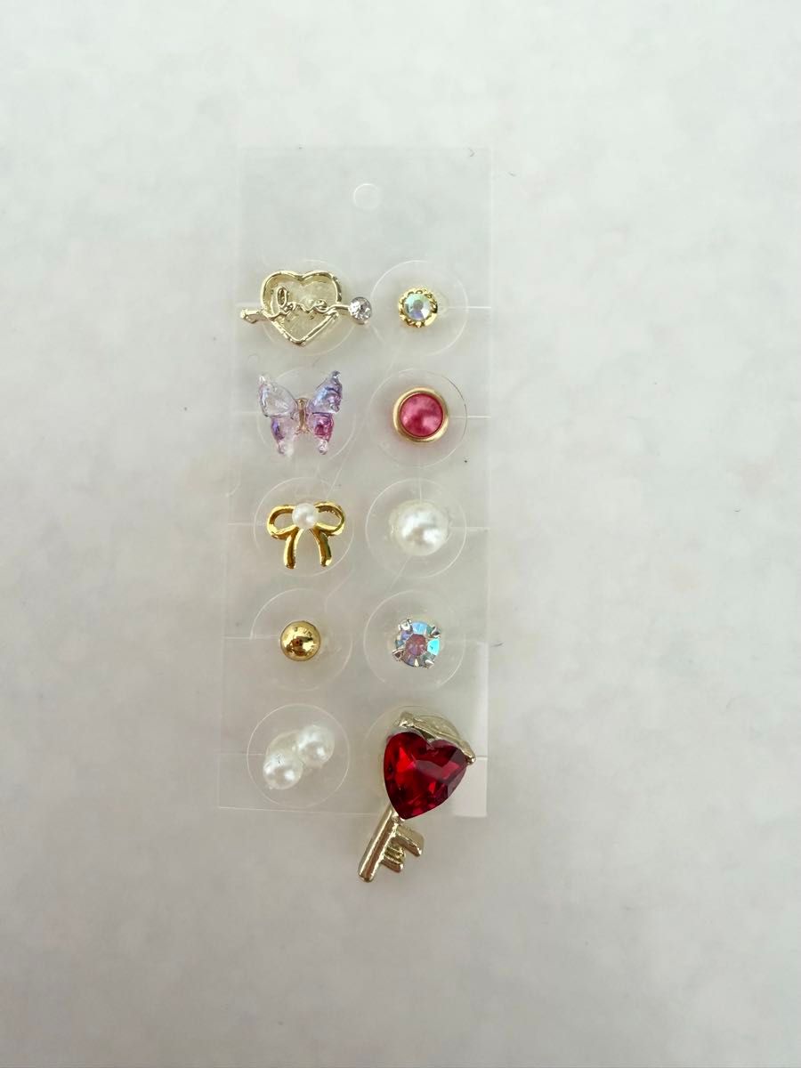 10-piece ear acupressure jewelry with love heart, key, ribbon, and pearls