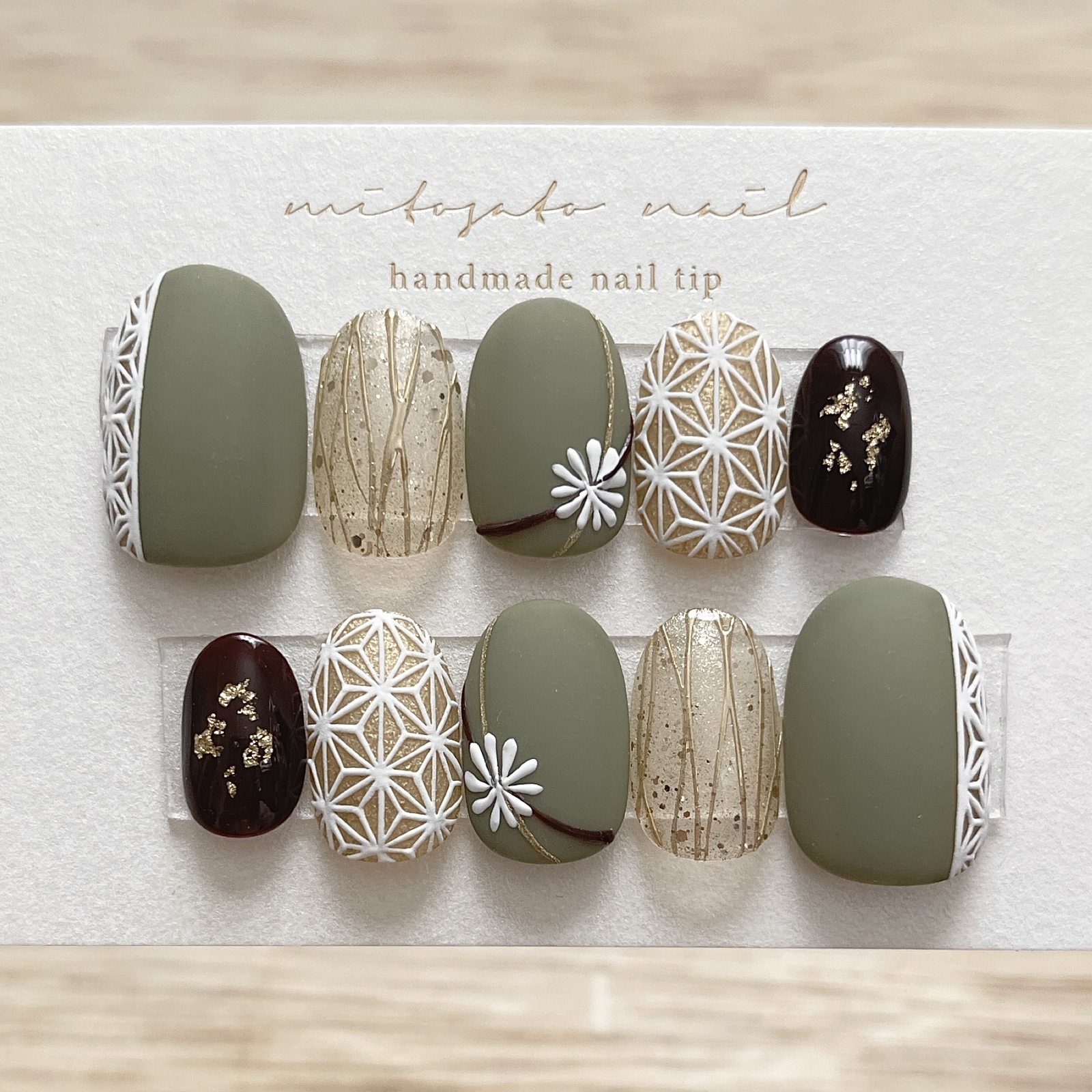 Japanese-style nail tips in black honey matcha color 🍵🌿 Perfect for autumn styling◎