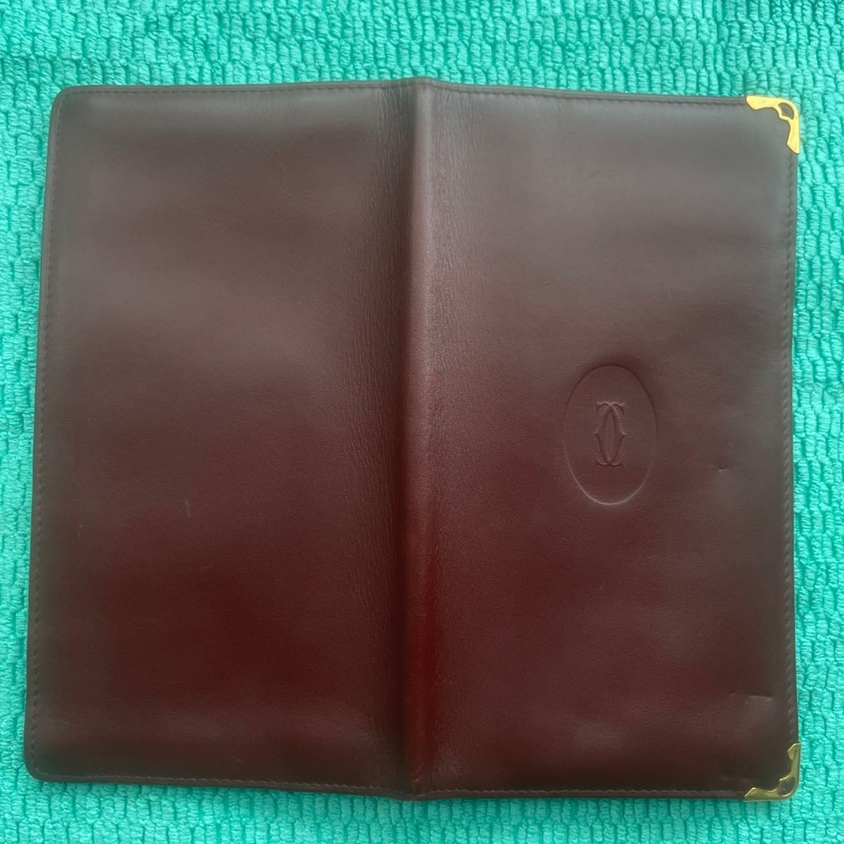 Excellent condition Cartier Mast Line bifold long wallet, Bordeaux/Burgundy with gold accents