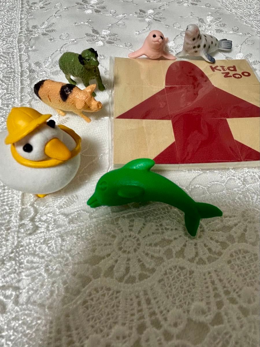 Animal figurines, erasers, and wooden puzzle
