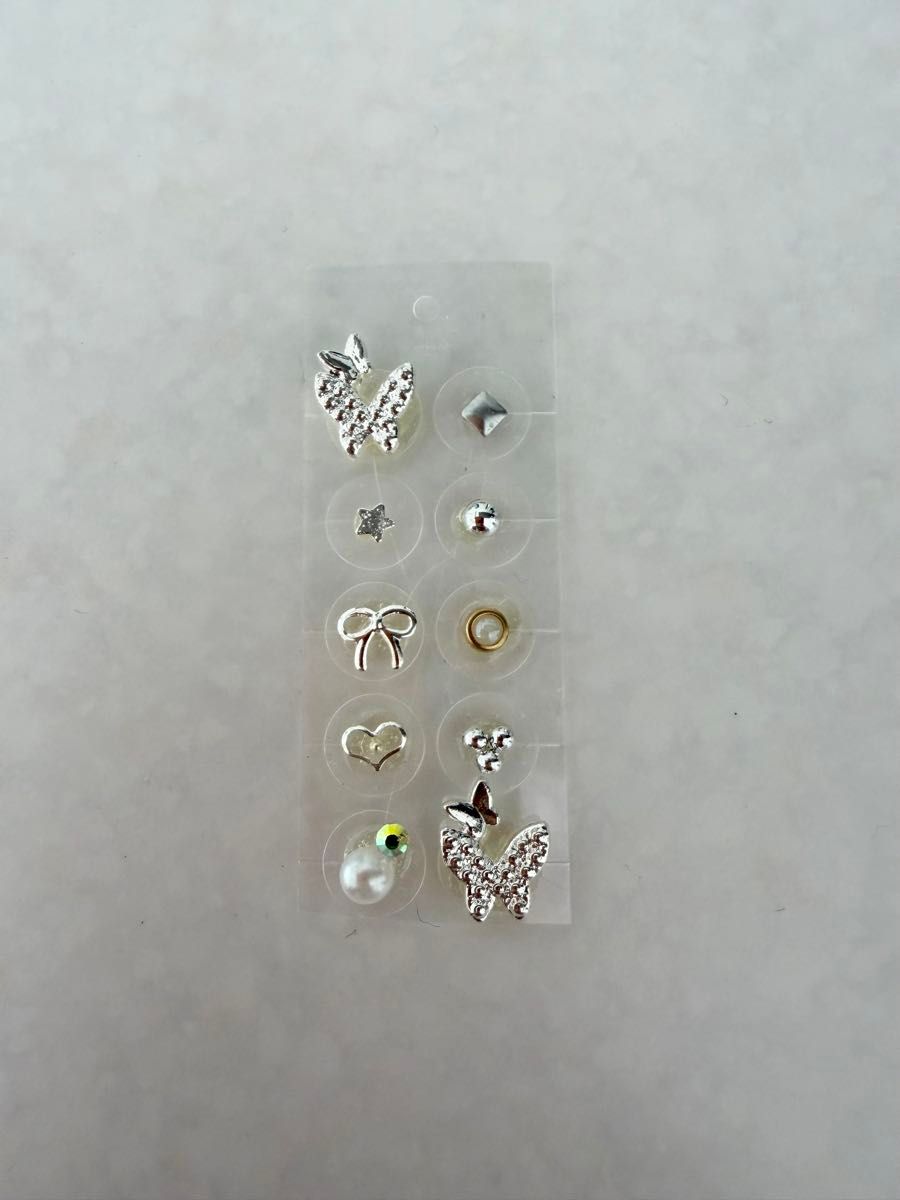 Ear acupressure jewelry, 10 pieces, silver butterfly and ribbon pearls.