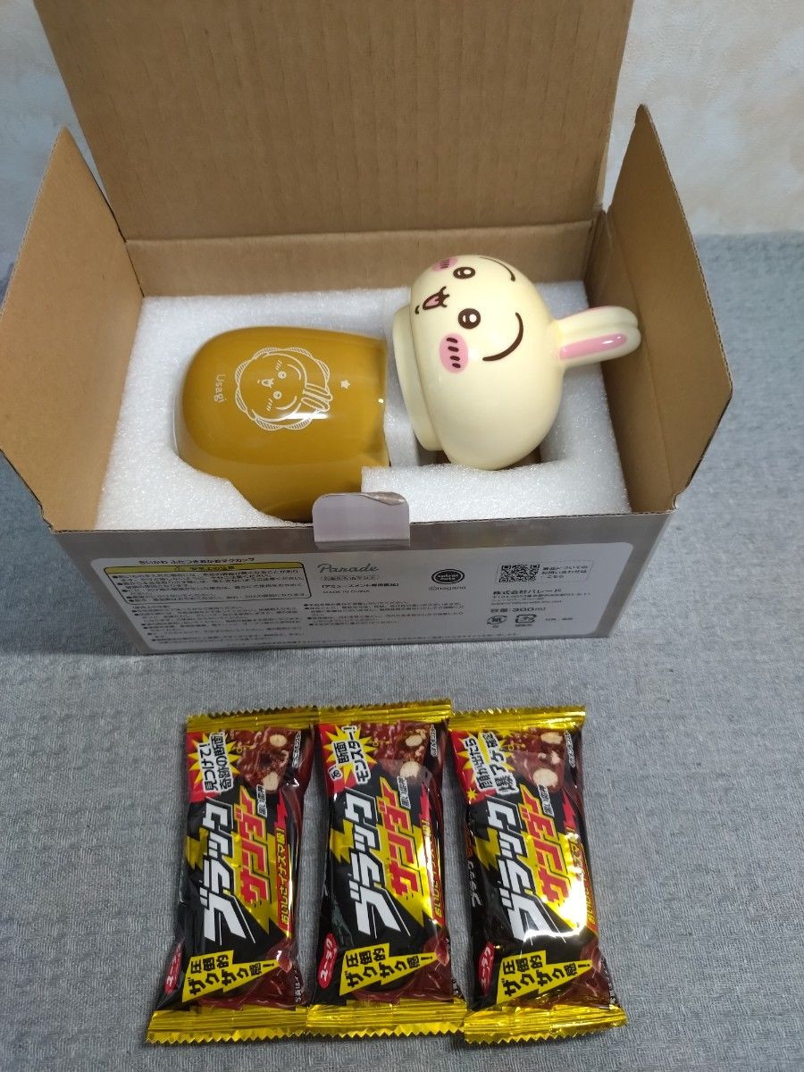 New, unused, comes with box: rabbit-themed mug with lid and a set of three Black Thunder chocolates; best-by date December 2026; shipping included