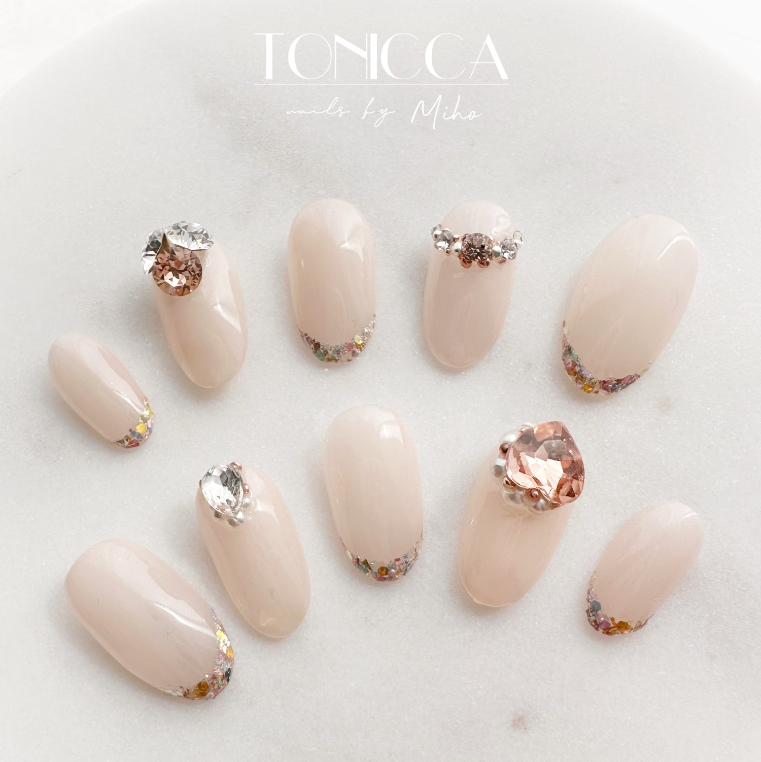 Elegant, simple glass French-style nail tips/for bridal, wedding, coming-of-age ceremonies, traditional Japanese attire, adorned with jewels, sparkling, Swarovski crystals, hearts, in pink and pink beige, featuring a French tip design, glass French style, and pearls—perfect for spring.