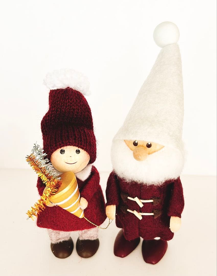 Santa in a Norrkoping Nisse Duffel Coat & Boy Holding a Cracker
