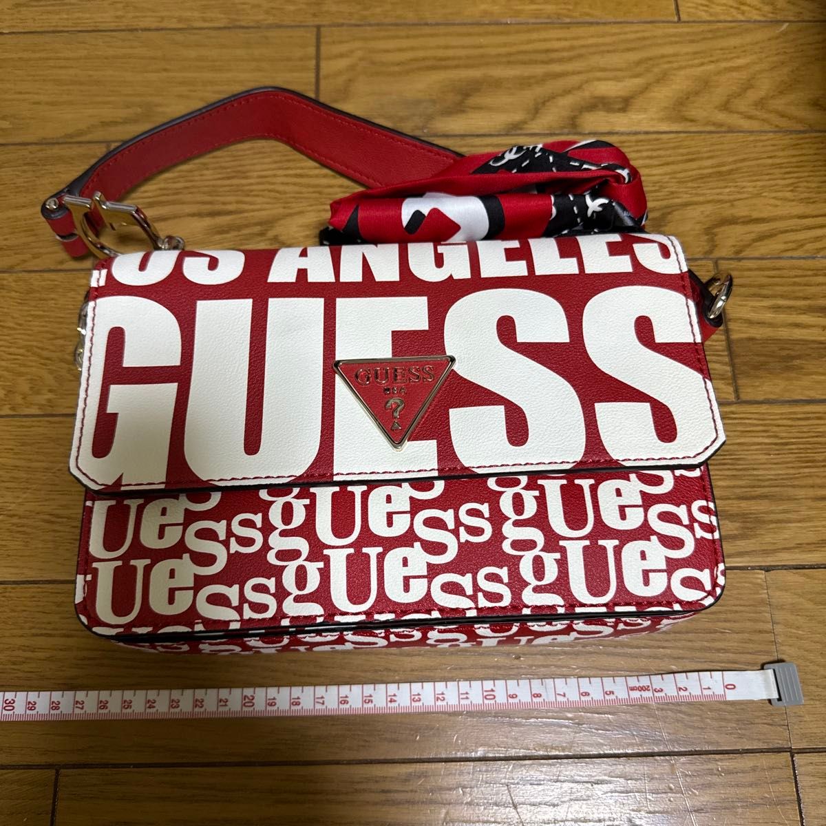 GUESS shoulder bag, red and white with all-over logo pattern, excellent condition