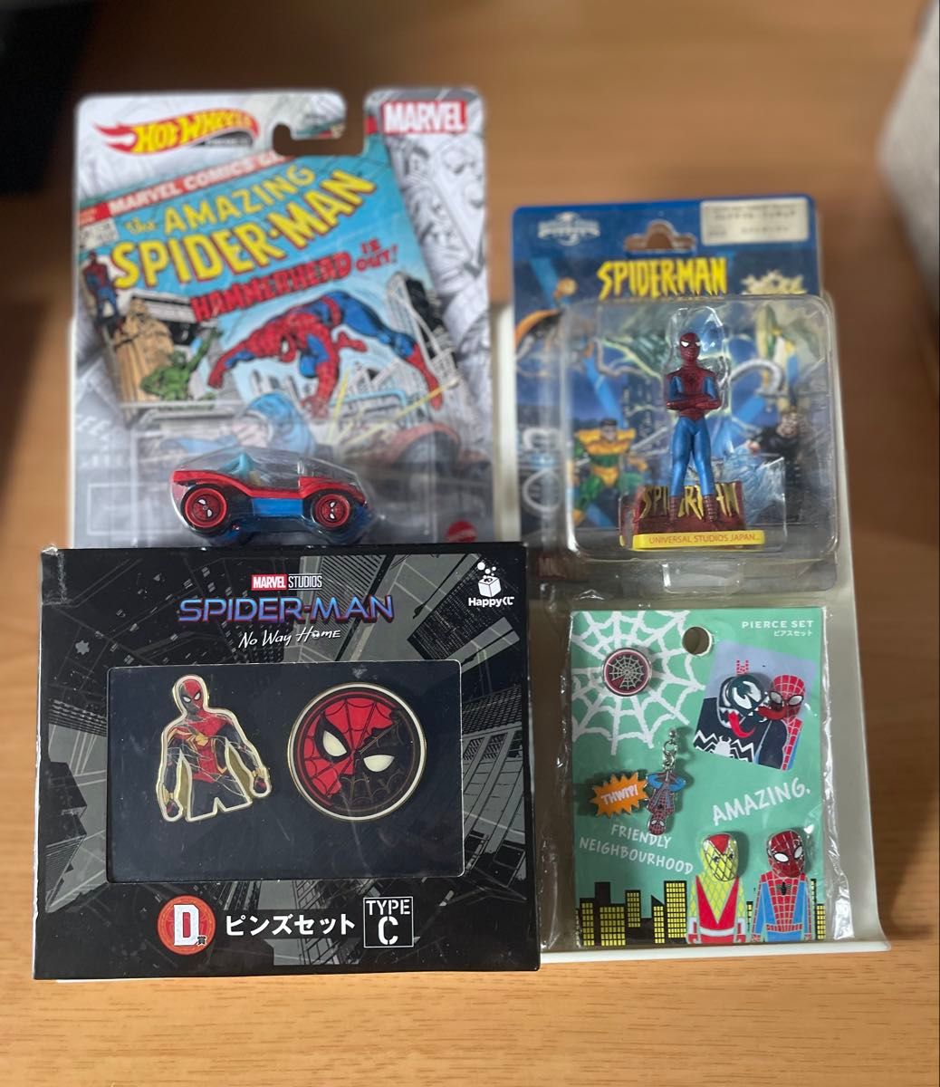 Spider-Man merchandise 4-piece set: Hot Wheels, pins, earrings, and figures