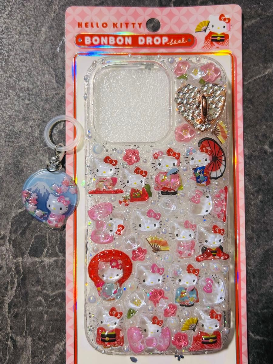 iPhone 16Pro case, Bonbon drop seal design, cute Japanese-style Kitty pattern, comes with a strap attachment and a free gift.