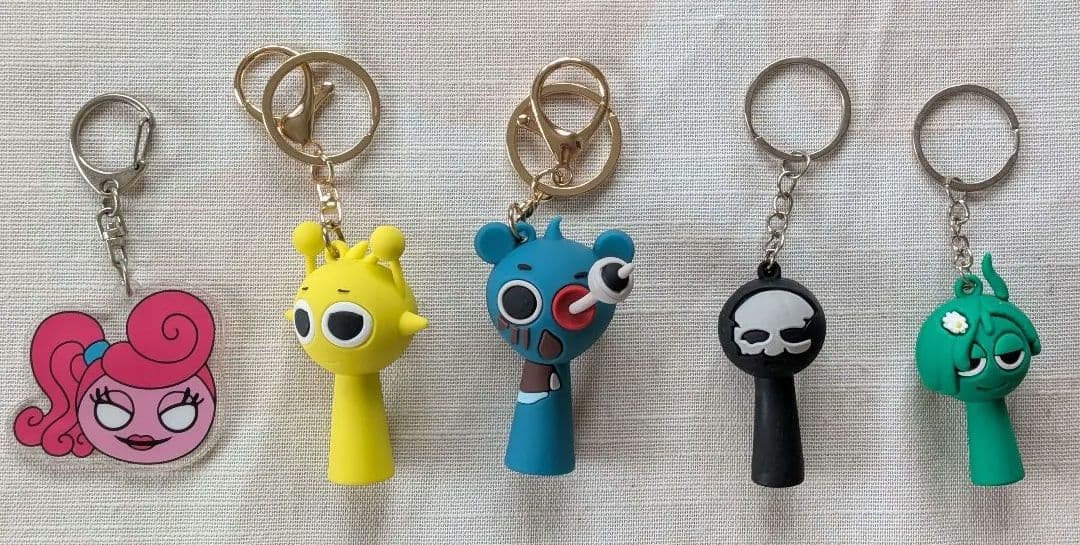 9. Splanky and Others Rubber & Acrylic Keychain 5-Piece Set, New and Unused