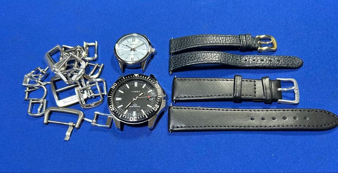 Wristwatch repair parts, bulk sale: watch case, strap, and buckle