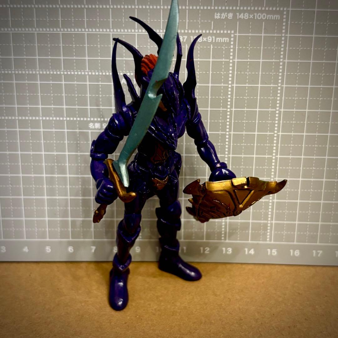 Vintage Yu-Gi-Oh! Duel Monsters DX Chaos Soldier figure, retro style.