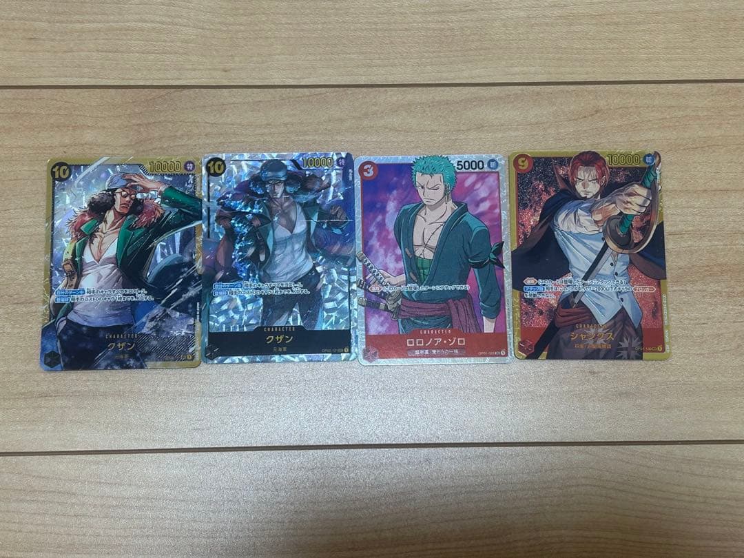 One Piece Card Game: Kuzan, Roronoa Zoro, Shanks – 4-Card Set