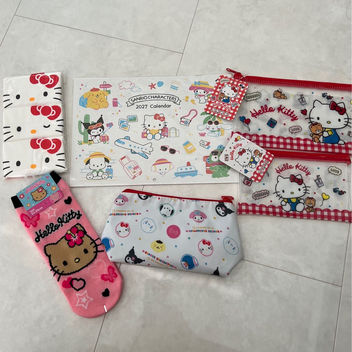 Below retail price! Sanrio Hello Kitty merchandise bundle—pouches, socks, and calendar.