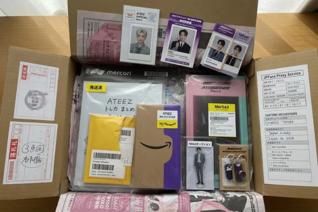 Multiple ATEEZ orders and collectible albums prepared for combined shipping from Japan