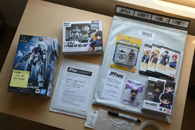 Several packaged Bandai collectibles prepared together for consolidated international shipping