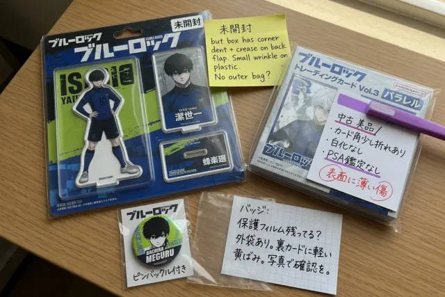 Close-up of Blue Lock Japanese merchandise packaging showing unopened condition and box damage notes