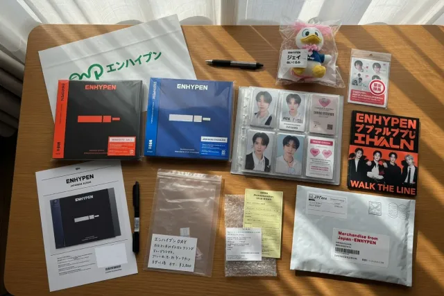ENHYPEN merchandise from Japan including albums, photocards, and character goods arranged for collectors