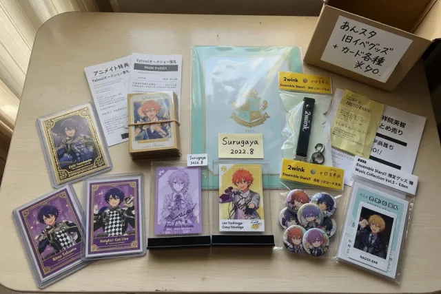 A display of Ensemble Stars!! merchandise from Japanese shops, including character cards, acrylic stands, and idol unit goods