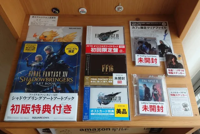 Japanese Final Fantasy art book, soundtrack CDs with obi strips, and exclusive store bonus items on a collector shelf
