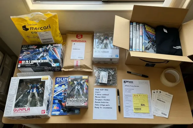 Gundam items from multiple Japanese stores, including Gunpla model kits and collectible figures arranged for one order