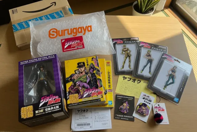 JoJo's Bizarre Adventure merchandise from Japan, including character figures, acrylic stands, and manga collectibles