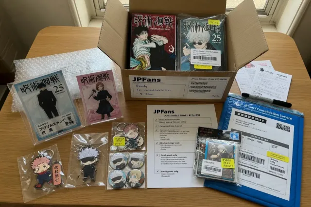 Several Jujutsu Kaisen purchases including manga, keychains, and acrylic stands prepared for consolidated shipping