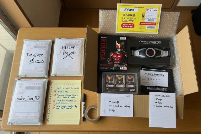 Packed Kamen Rider figures, transformation belts, and cards prepared for combined international shipping from Japan