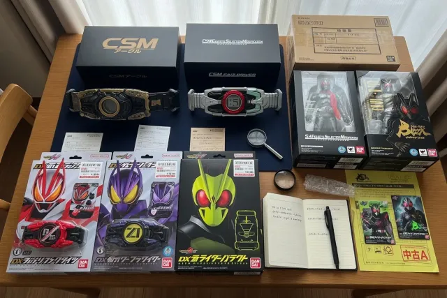 Kamen Rider DX Driver and CSM belt collector items displayed together