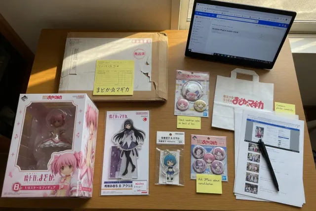 Madoka Magica merchandise including character figures, acrylic stands, and collectible goods from Japan