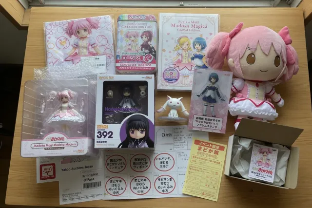 Madoka Magica figures and plushies displayed with limited-edition Japanese merchandise