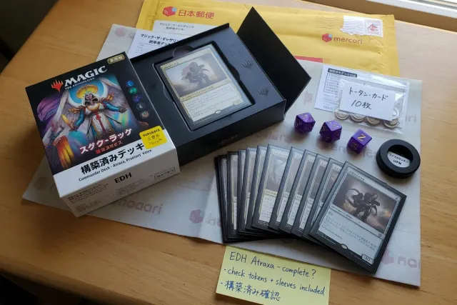 Japanese Magic The Gathering Commander deck box with sleeved cards and dice