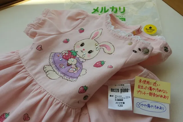 Close-up of Mezzo Piano dress embroidery, care label and fabric condition for mezzo piano resale shopping