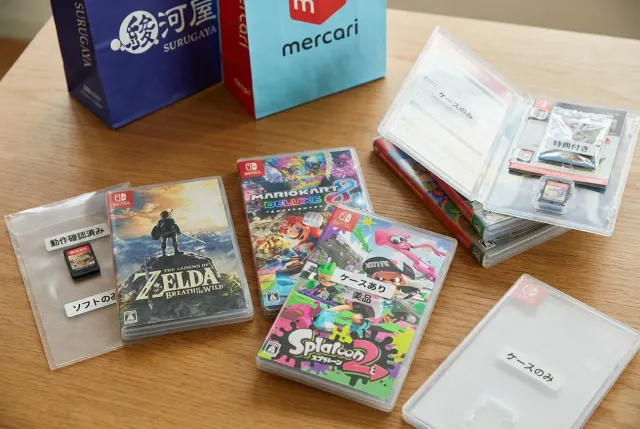 Used Nintendo Switch game cartridges and cases with Japanese condition labels