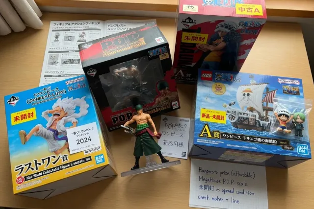 One Piece figures and LEGO One Piece sets photographed with original Japanese retail boxes
