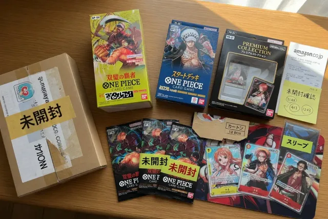 One Piece Card Game booster boxes, starter decks and rare Japanese cards arranged for collectors
