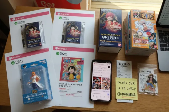 Japanese marketplace listings for One Piece collectibles, including sealed card boxes, figures, manga and character goods