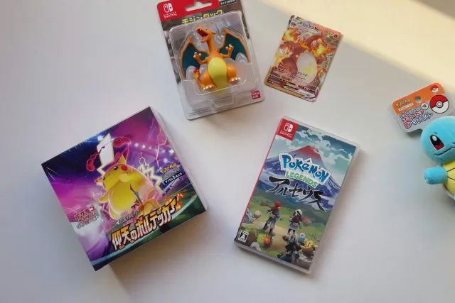 Packed Pokémon cards, plush toys, and Japanese Pokémon stationery prepared for international shipping