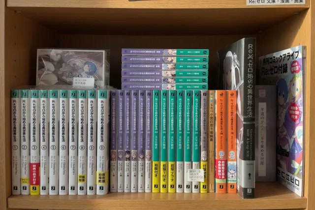 A shelf of Japanese Re:Zero light novels, manga volumes, art books, and Blu-ray releases from Japan