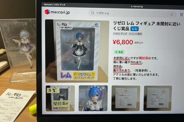 Close-up of a Japanese Re:Zero listing showing a boxed Rem figure, condition notes, price, and product photos