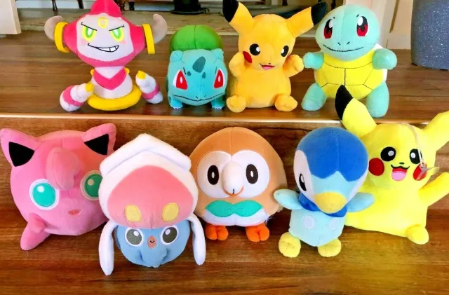 Colorful Pokémon plush toys and Pokémon figures in original Japanese packaging on shop shelves