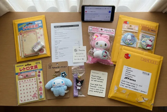 Colorful Sanrio items from Japanese marketplaces, including plush toys, keychains, stationery, and character collectibles