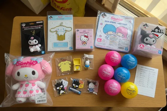 A display of Sanrio plush, acrylic stands, gachapon capsules, and Ichiban Kuji prize goods from Japan