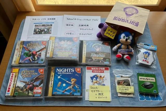 Japanese-exclusive SEGA games and collectibles displayed in a retro game collection