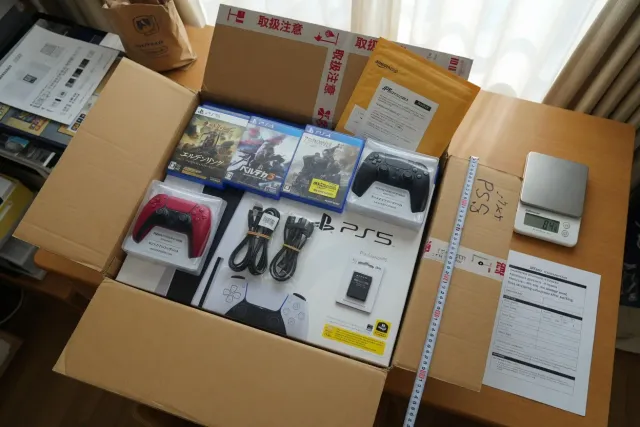 Packed Sony PlayStation console, controllers and games prepared for international shipping from Japan