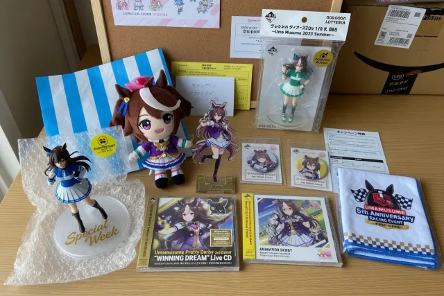 Umamusume: Pretty Derby merchandise display with character figures, acrylic stands, CDs, and plush from Japanese shops